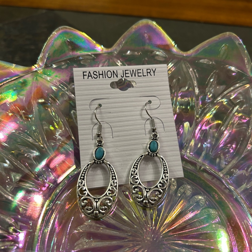 Silver Oval Filagree Design hanging earring w/ small crackle turquiose stone.